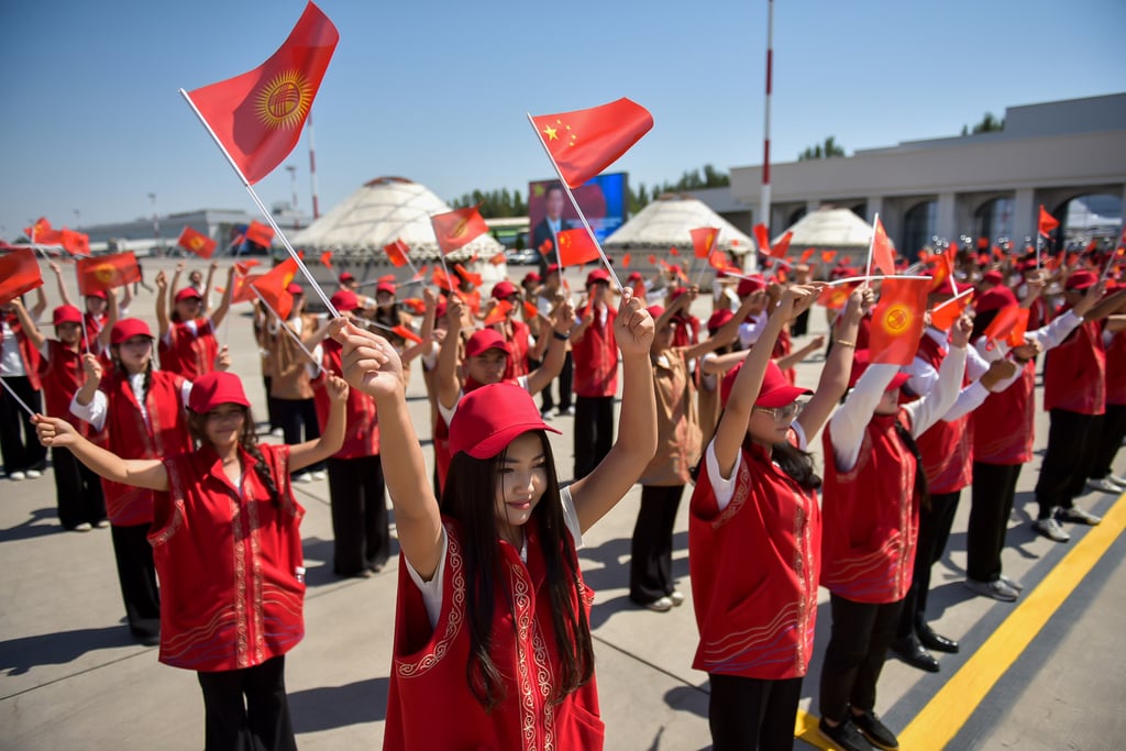 Kyrgyz performers wave Chinese flags as Chinese President Xi Jinping and his wife Peng Liyuan arrive in Bishkek, Kyrgyzstan, on August 30. Photo: Kyrgyzstan’s Presidential Press Office via AP Kyrgyz performers wave Chinese flags as Chinese President Xi Jinping and his wife Peng Liyuan arrive in Bishkek, Kyrgyzstan, on August 30. Photo: Kyrgyzstan’s Presidential Press Office via AP