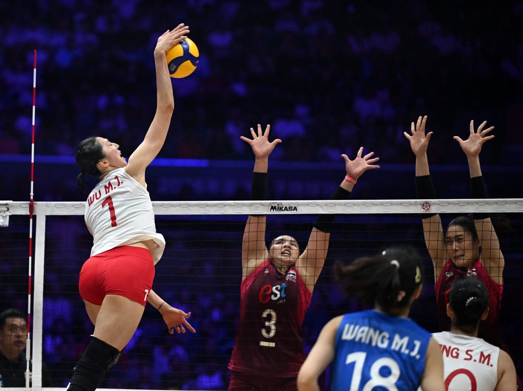 China’s Wu Mengjie (left) spikes the ball during the final against Thailand. Photo: Xinhua China’s Wu Mengjie (left) spikes the ball during the final against Thailand. Photo: Xinhua