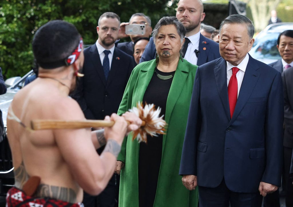 Vietnam’s President To Lam (right) watches a Maori performer during a welcome ceremony at the Government House in Auckland on August 13. Photo: AFP