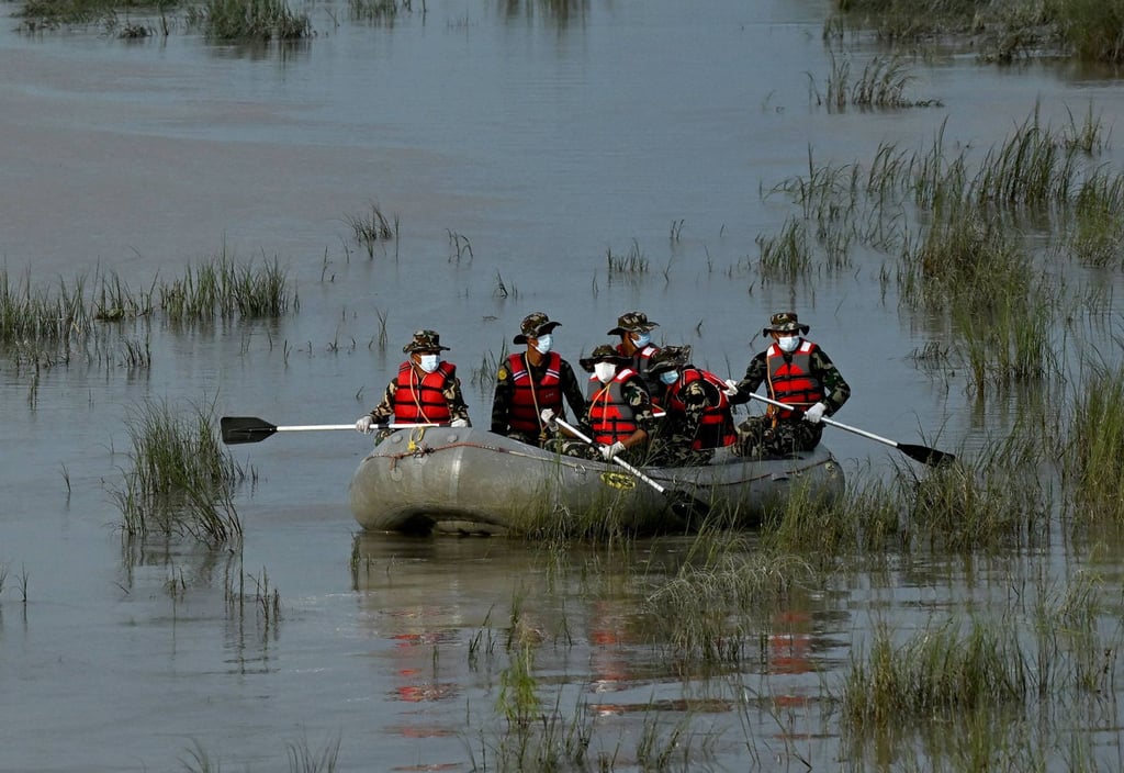 Army personnel conduct a search and rescue operation for flood victims along the Narayani river at Bharatpur in Nepal’s Chitwan district on Sunday. Photo: AFP Army personnel conduct a search and rescue operation for flood victims along the Narayani river at Bharatpur in Nepal’s Chitwan district on Sunday. Photo: AFP