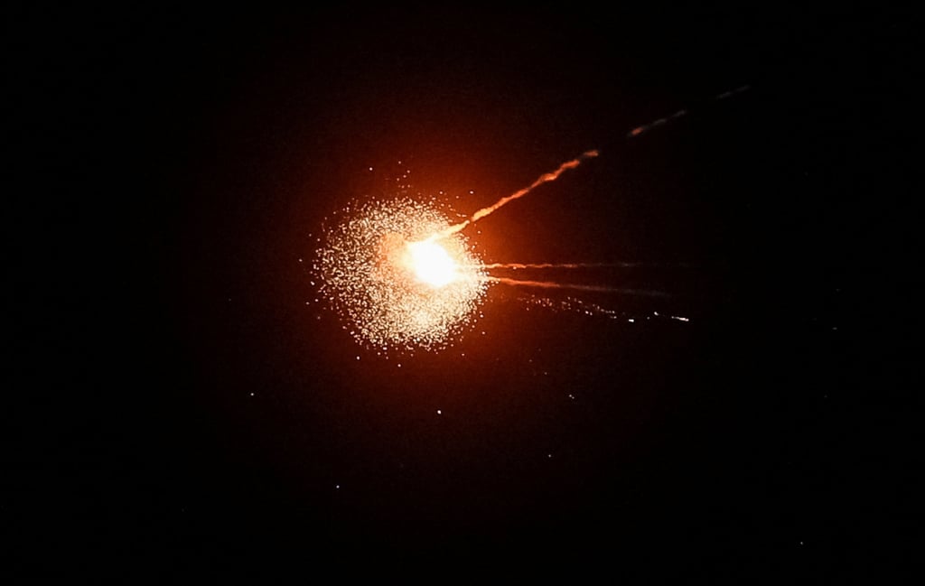 Ukrainians hit a Russian missile during an attack on Kyiv Monday. Photo: Reuters