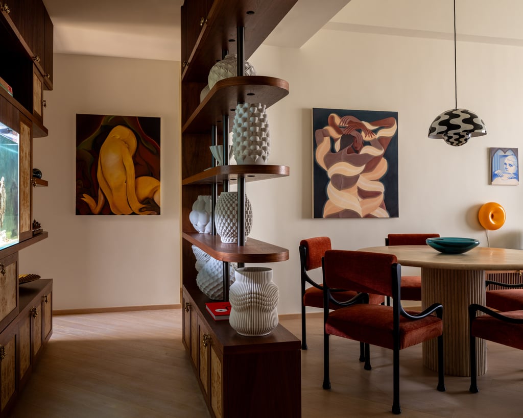 In a section behind the dining area, open shelving lets in more light and an aquarium enhances feng shui. Photo: Common Studio