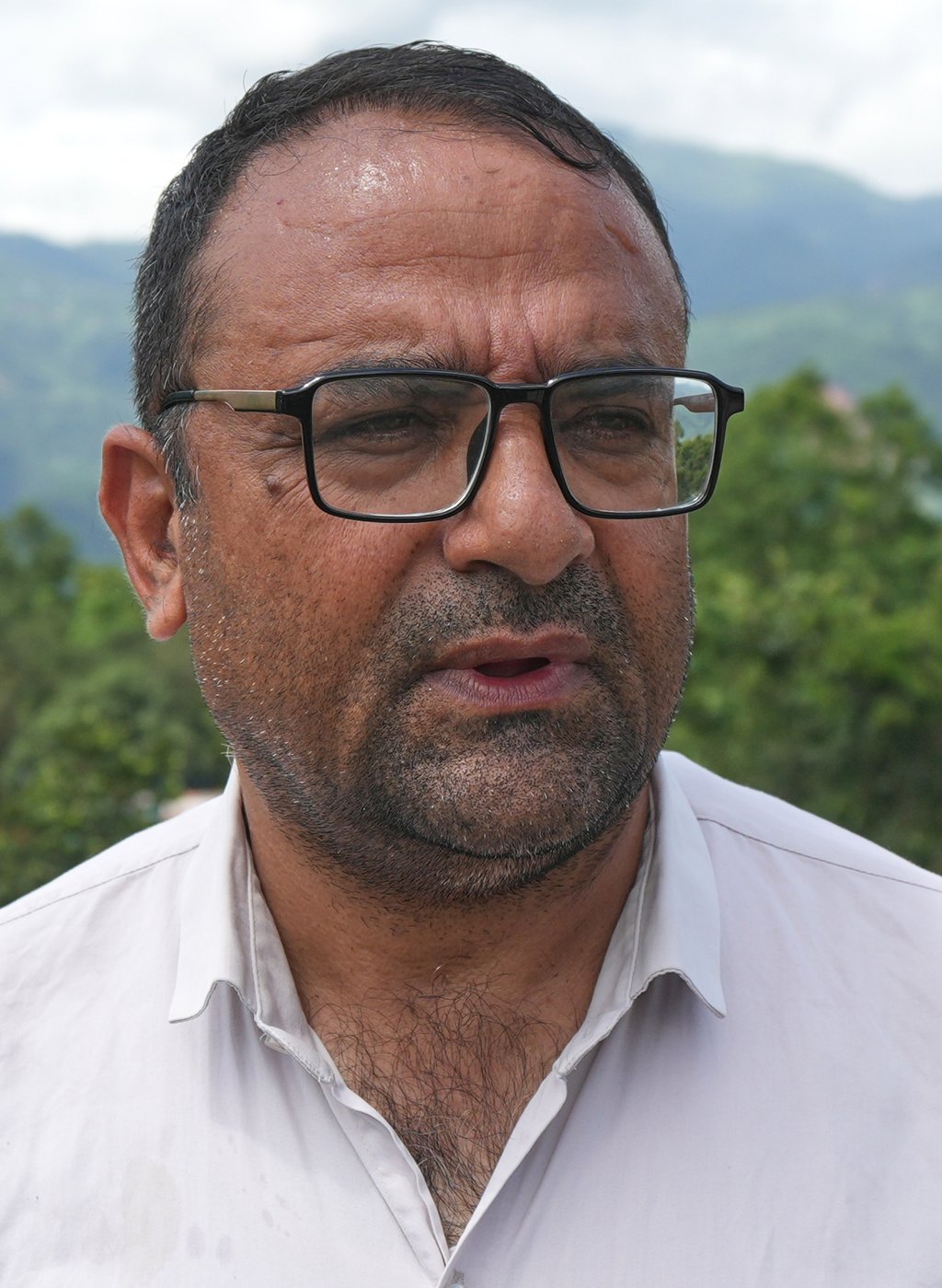 Tribhuvan Trishuli Secondary School principal Rajendra Dawadi looks across to Trishuli Valley in Nepal’s Nuwakot district on Monday. Photo: AP Tribhuvan Trishuli Secondary School principal Rajendra Dawadi looks across to Trishuli Valley in Nepal’s Nuwakot district on Monday. Photo: AP