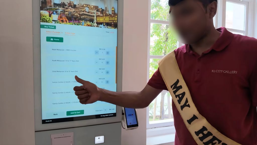 A still from a social media video shows a member of staff helping tourists at the KL City Gallery in the Sultan Abdul Samad Building, Kuala Lumpur, Malaysia. Photo: YouTube