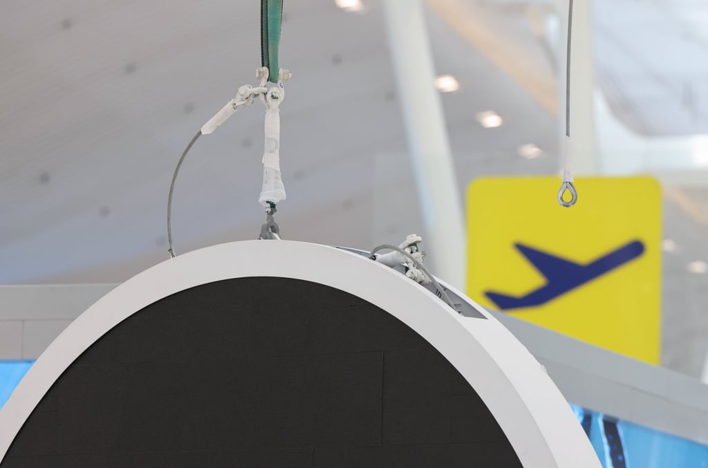 An overhead electronic display was seen dangling in the air at Terminal 2. Photo: Nora Tam