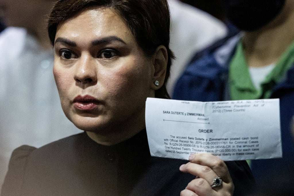 Philippine Vice-President Sara Duterte-Carpio shows a court order confirming she posted bail at a Quezon City court on Saturday. Photo: Reuters