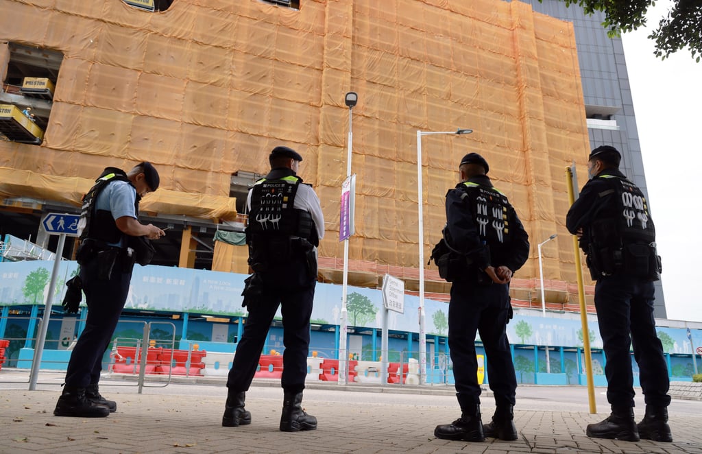 Police officers guard outside the Legislative Council building. Photo: May Tse