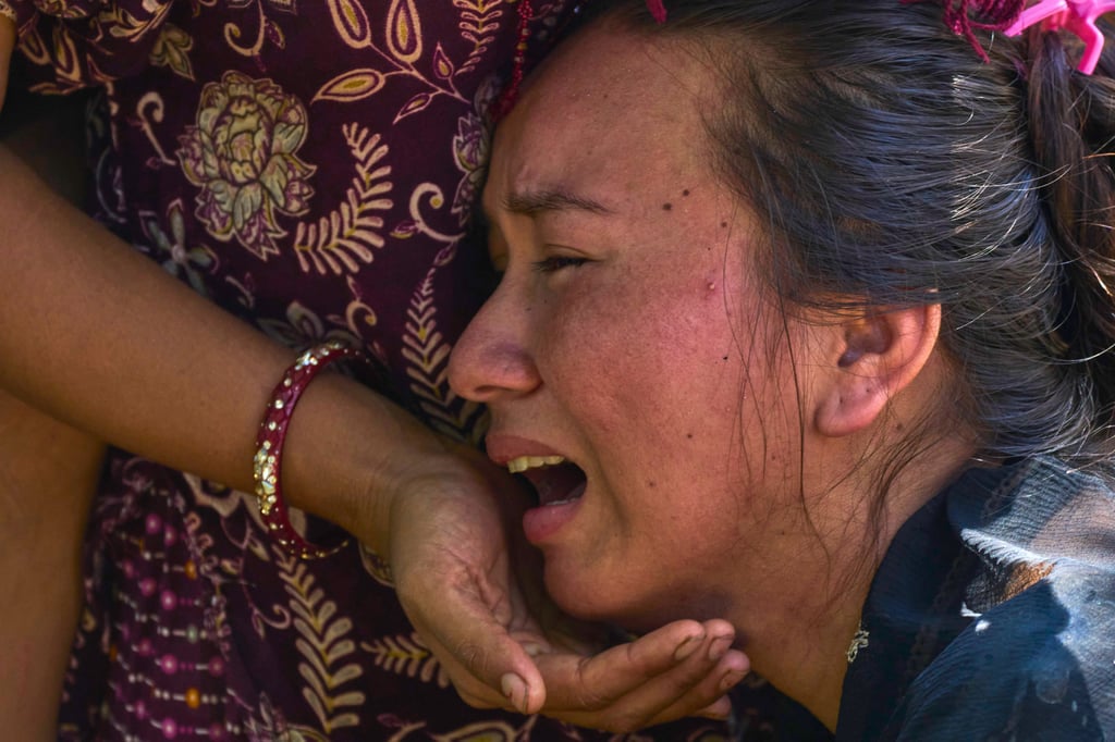 A girl cries as she waits for news of relatives missing after last week’s fatal flash floods in Bidur in Nepal’s Nuwakot district. Photo: AP A girl cries as she waits for news of relatives missing after last week’s fatal flash floods in Bidur in Nepal’s Nuwakot district. Photo: AP