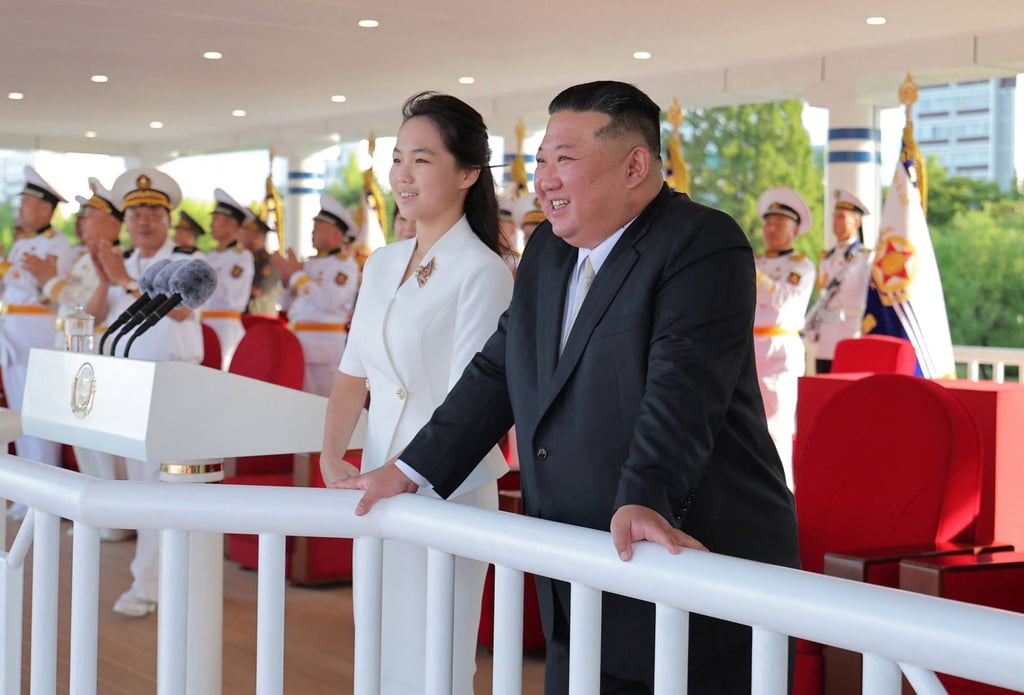 North Korean leader Kim Jong-un and his daughter, Ju-ae, watch the commissioning of the Kang Kon at Wonsan Port on Sunday. Photo: KCNA / AFP