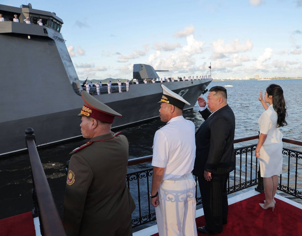 North Korean leader Kim Jong-un salutes the Kang Kon while his daughter Ju-ae waves during a commissioning ceremony at Wonsan Port on Sunday. Photo: KCNA / AFP North Korean leader Kim Jong-un salutes the Kang Kon while his daughter Ju-ae waves during a commissioning ceremony at Wonsan Port on Sunday. Photo: KCNA / AFP