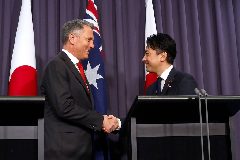 Australian Defence Minister Richard Marles (left) shakes hands with Japanese Defence Minister Shinjiro Koizumi during a press conference in Canberra on August 18. Photo: AFP