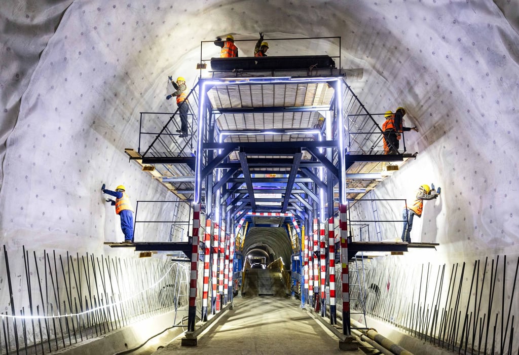 Workers in a tunnel in Kyrgyzstan, part of the 523km China-Kyrgyzstan-Uzbekistan Railway which is scheduled for completion in 2031. Photo: Xinhua Workers in a tunnel in Kyrgyzstan, part of the 523km China-Kyrgyzstan-Uzbekistan Railway which is scheduled for completion in 2031. Photo: Xinhua