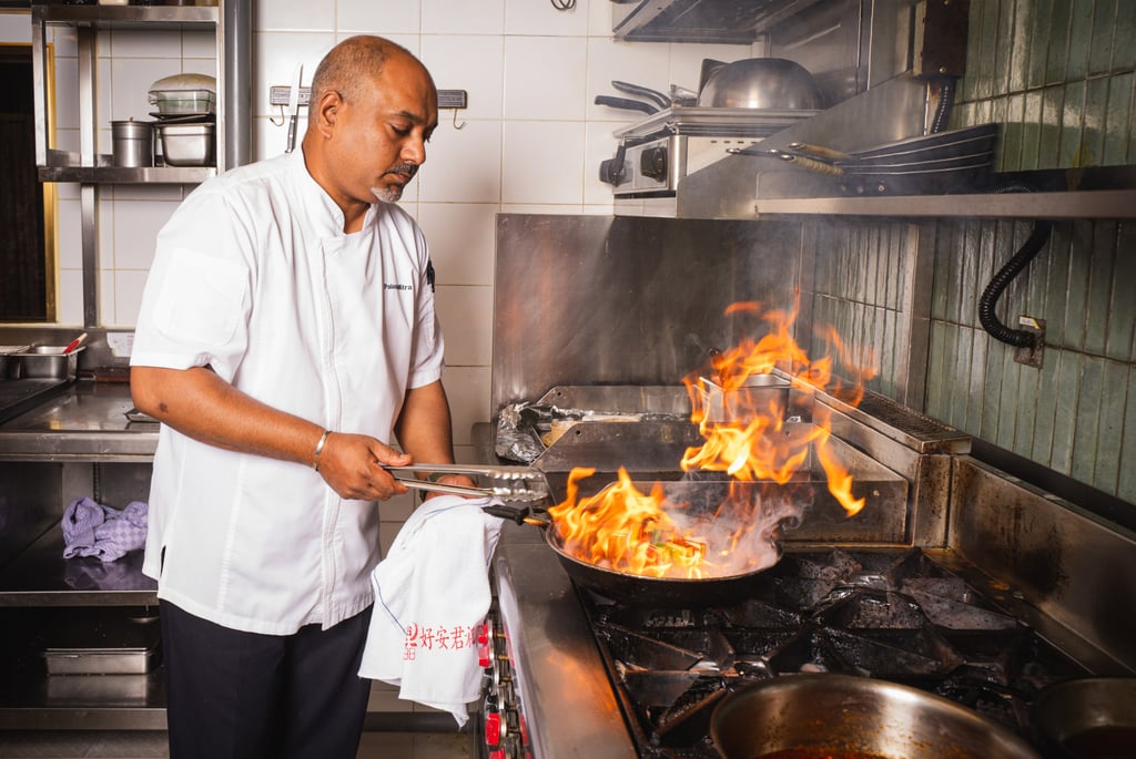 Mitra makes chilli paneer skewers in the Prince and the Peacock kitchen. Photo: Alexander Mak Mitra makes chilli paneer skewers in the Prince and the Peacock kitchen. Photo: Alexander Mak