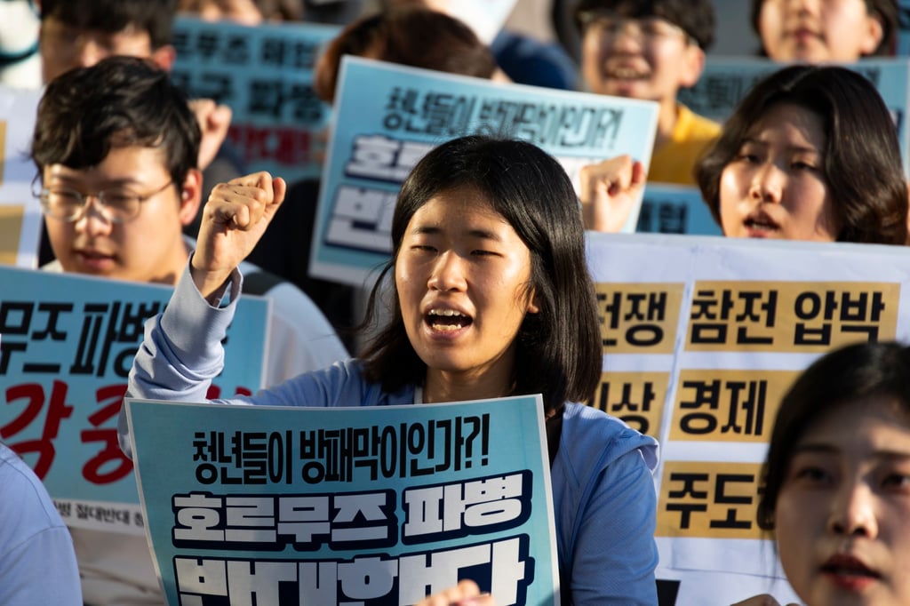 South Korean university protesters shout slogans during a rally near the US embassy in Seoul on Monday to oppose a potential deployment of South Korean troops to the Strait of Hormuz. Photo: EPA