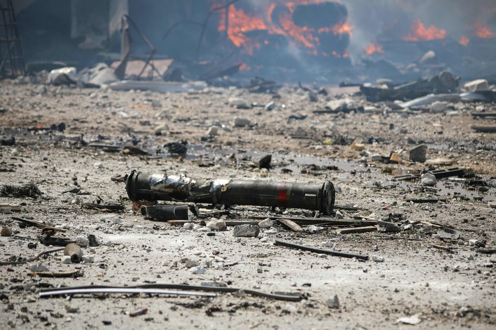 Weapons are seen scattered at the site of an explosion that took place at a temporary arms depot in the town of Samarda in Idlib province, Syria, on Wednesday. Photo: AFP