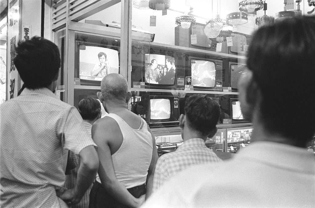 Televisions in a retail shop broadcasting the news of Mao Zedong’s death. Photo: M. Chan