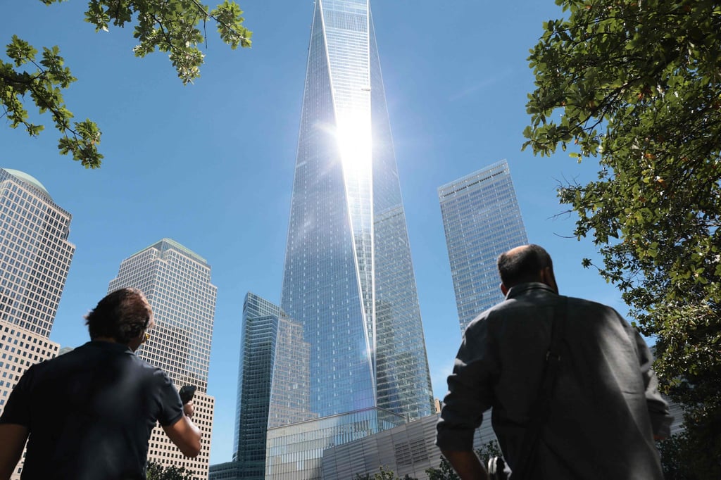 People visit the North Pool at the National 9/11 Memorial and Museum in New York on Tuesday. Photo: AFP