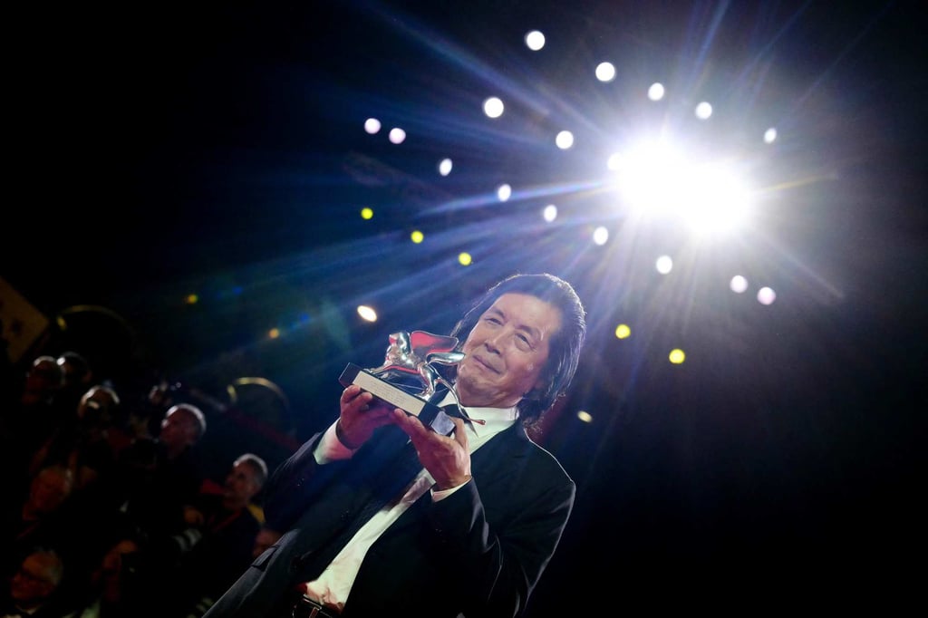 Director Lee Chang-dong, winner of the Silver Lion for “Possible Love”, poses for photos after the closing ceremony of the 83rd Venice Film Festival on Saturday. Photo: AFP