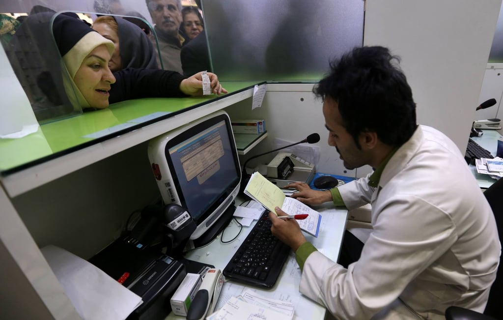 Iranians wait to get prescription medicines in Tehran during the Covid-19 pandemic. The current war is also hampering the sourcing of their drugs. Photo: AFP