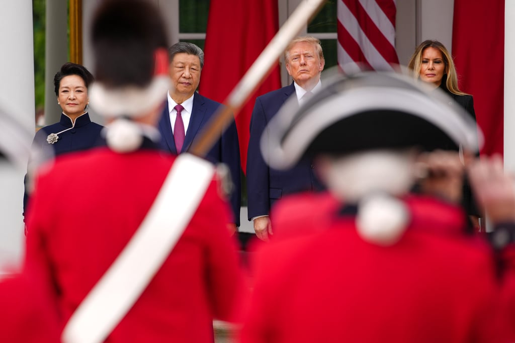 Chinese first lady Peng Liyuan, Chinese President Xi Jinping, US President Donald Trump and first lady Melania Trump attend a military review in the Rose Garden of the White House in Washington on Thursday. Photo: Getty Images