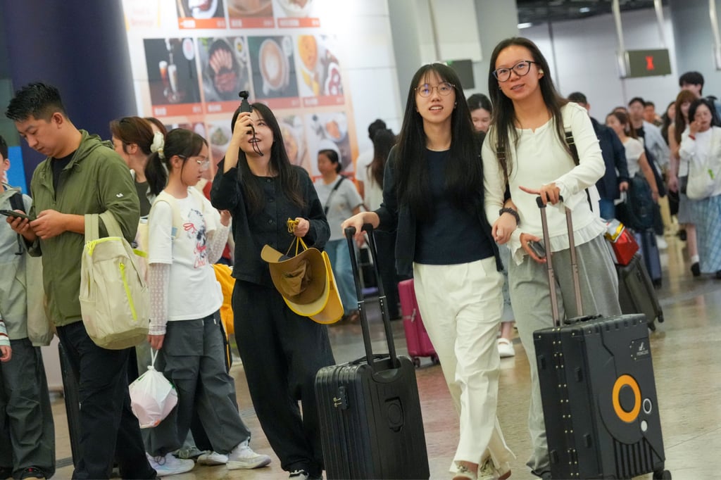 Tourists arrive at the West Kowloon high-speed rail terminus on the first day of mainland China’s Labour Day “golden week” break. Photo: Jelly Tse