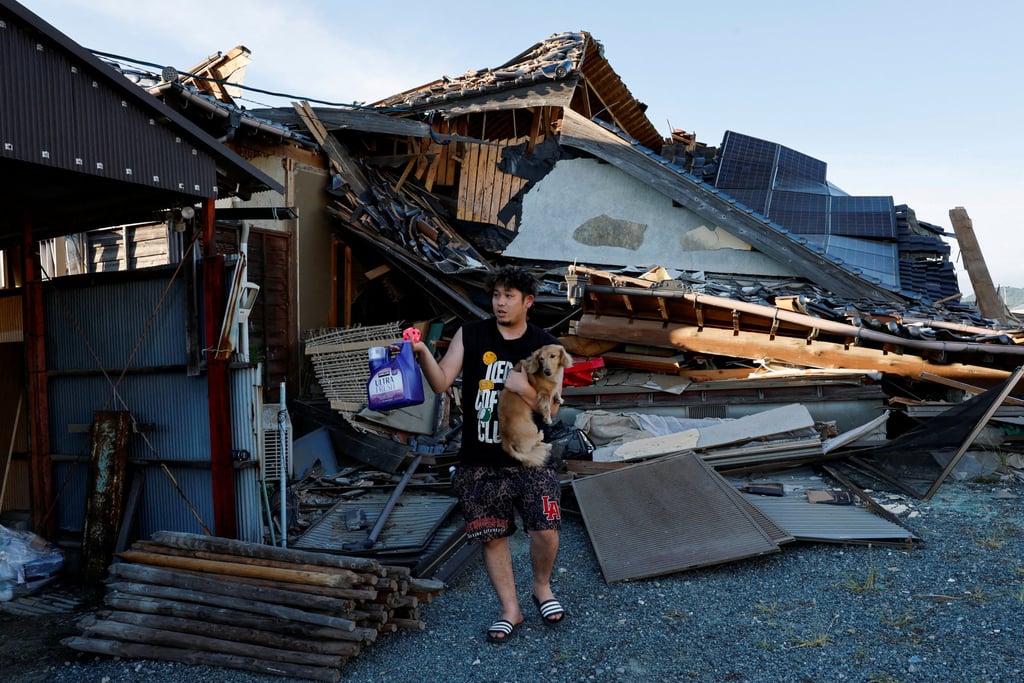 A resident retrieves belongings from a collapsed home following a magnitude 7.1 earthquake in Kumamoto prefecture, Japan, in July. Photo: Reuters A resident retrieves belongings from a collapsed home following a magnitude 7.1 earthquake in Kumamoto prefecture, Japan, in July. Photo: Reuters