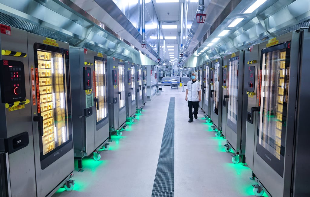 The facility, located in Tung Chung on Lantau Island, deploys X-ray sorting, robotic arms and cook-chill kitchen technology. Photo: Edmond So