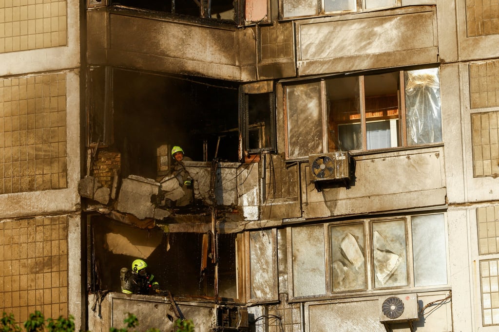 Firefighters work at a residential building hit by a Russian drone strike in Kyiv, Ukraine, on Sunday. Photo: Reuters Firefighters work at a residential building hit by a Russian drone strike in Kyiv, Ukraine, on Sunday. Photo: Reuters