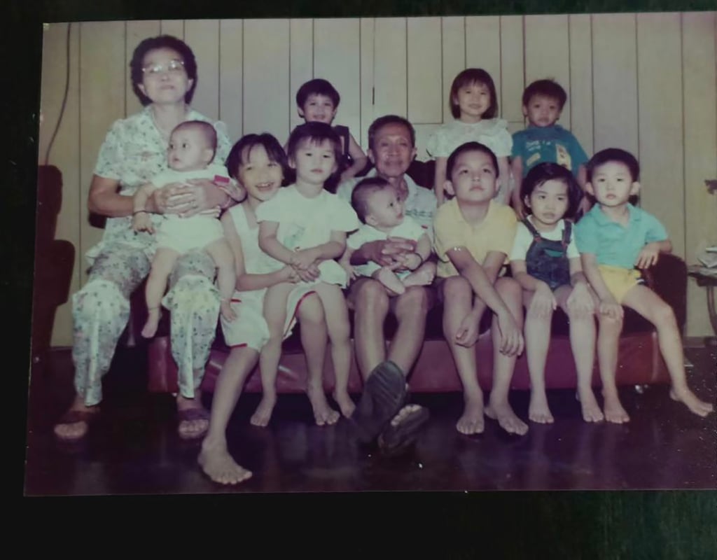 Kuang Jinyuan, centre, was photographed with his family members in Malaysia. Photo: Xinhua Kuang Jinyuan, centre, was photographed with his family members in Malaysia. Photo: Xinhua