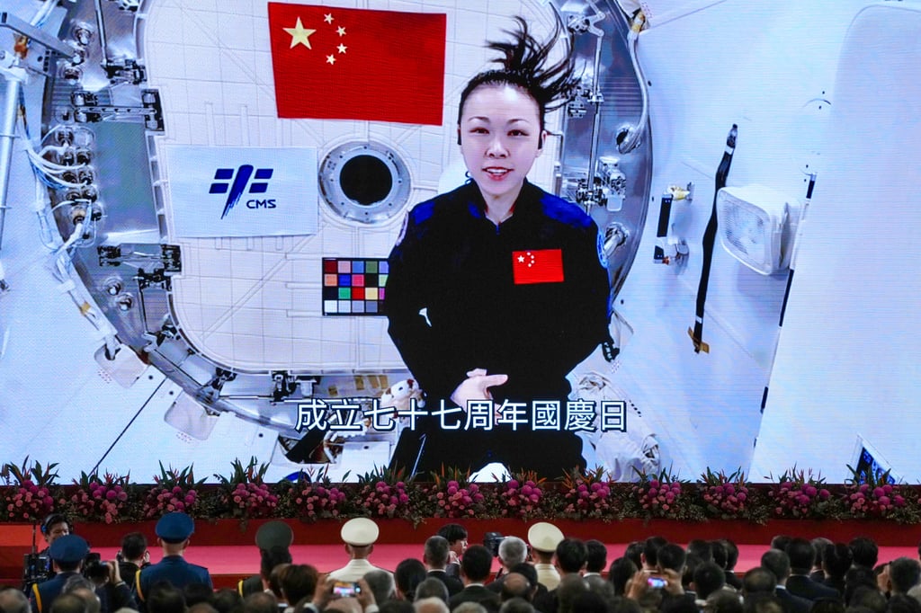 Hong Kong astronaut Lai Ka-ying delivers a speech from outer space at the National Day reception on Thursday. Photo: Karma Lo