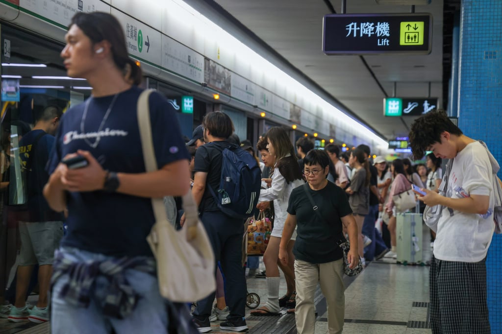 Commuters pass through Kowloon Tong MTR station on National Day. Photo: Silvia Siu