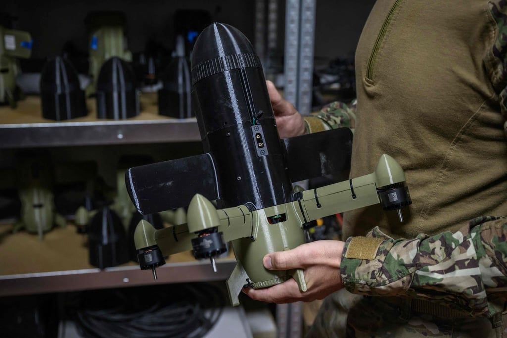 A Ukrainian soldier holds an interceptor drone near the front lines in eastern Ukraine in October 2025. Photo: AFP