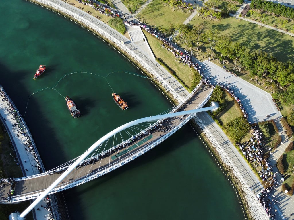 A drone view of boats and a net during an operation to guide the shark out of a canal at the North Port in Busan on Friday. Photo: Reuters A drone view of boats and a net during an operation to guide the shark out of a canal at the North Port in Busan on Friday. Photo: Reuters
