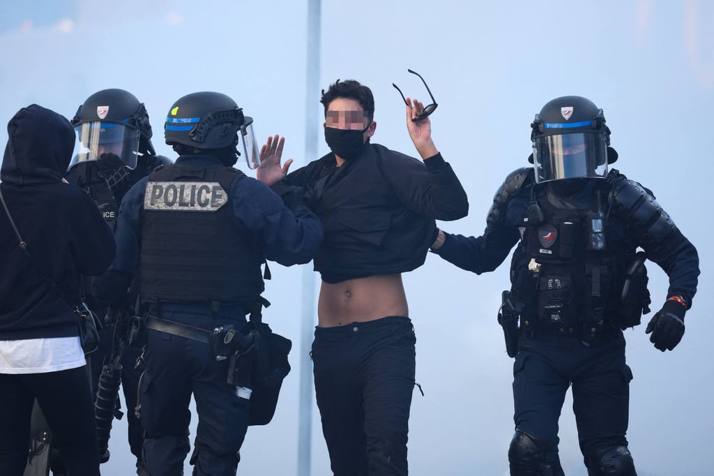 Police officers hold a protestor in Brest, western France, on Friday. Photo: AFP Police officers hold a protestor in Brest, western France, on Friday. Photo: AFP