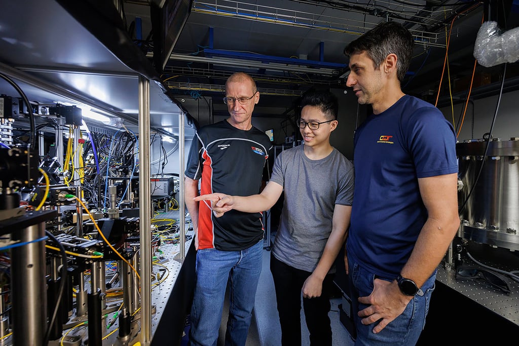 The NUS research team (from left) Murray Barrett, Michael Lee and Kyle Arnold with the lutetium atomic clock. Photo: Centre for Quantum Technologies The NUS research team (from left) Murray Barrett, Michael Lee and Kyle Arnold with the lutetium atomic clock. Photo: Centre for Quantum Technologies