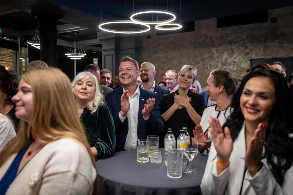 Supporters of Latvia’s Prime Minister Andris Kulbergs applaud as he speaks at an election night event in Riga on Saturday. Photo: AFP Supporters of Latvia’s Prime Minister Andris Kulbergs applaud as he speaks at an election night event in Riga on Saturday. Photo: AFP