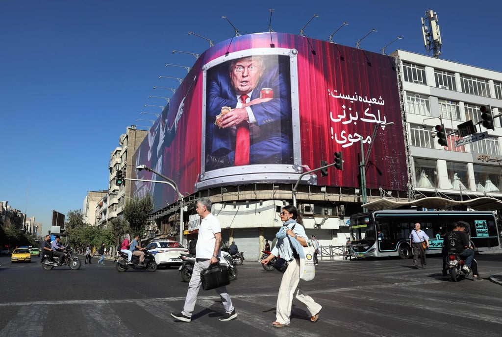 Iranians walk past an anti-Trump billboard along a street in Tehran last month. Photo: AFP Iranians walk past an anti-Trump billboard along a street in Tehran last month. Photo: AFP
