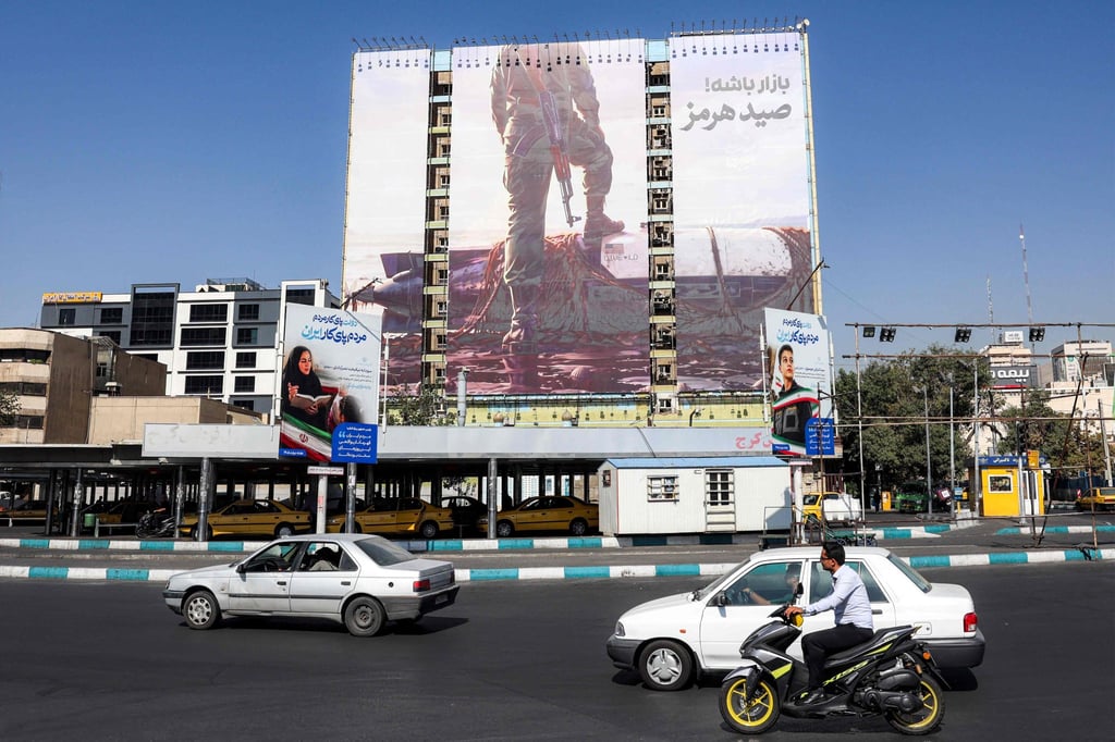 A billboard erected on the facade of a building in Tehran depicts a member of Iran’s Islamic Revolutionary Guards Corps placing his foot on a US sea drone. Photo: AFP A billboard erected on the facade of a building in Tehran depicts a member of Iran’s Islamic Revolutionary Guards Corps placing his foot on a US sea drone. Photo: AFP
