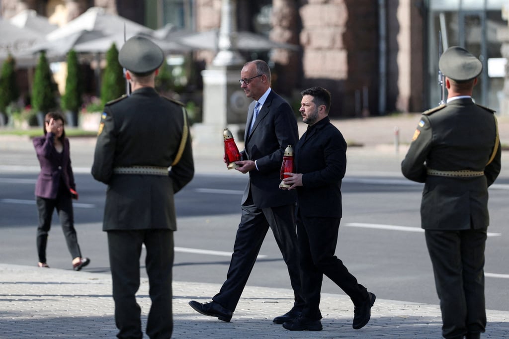 Ukraine’s President Volodymyr Zelensky and German Chancellor Friedrich Merz pay tribute at the makeshift memorial to fallen Ukrainian defenders, amid Russia’s attack on Ukraine, at Independence Square in Kyiv on Sunday. Photo: Reuters Ukraine’s President Volodymyr Zelensky and German Chancellor Friedrich Merz pay tribute at the makeshift memorial to fallen Ukrainian defenders, amid Russia’s attack on Ukraine, at Independence Square in Kyiv on Sunday. Photo: Reuters