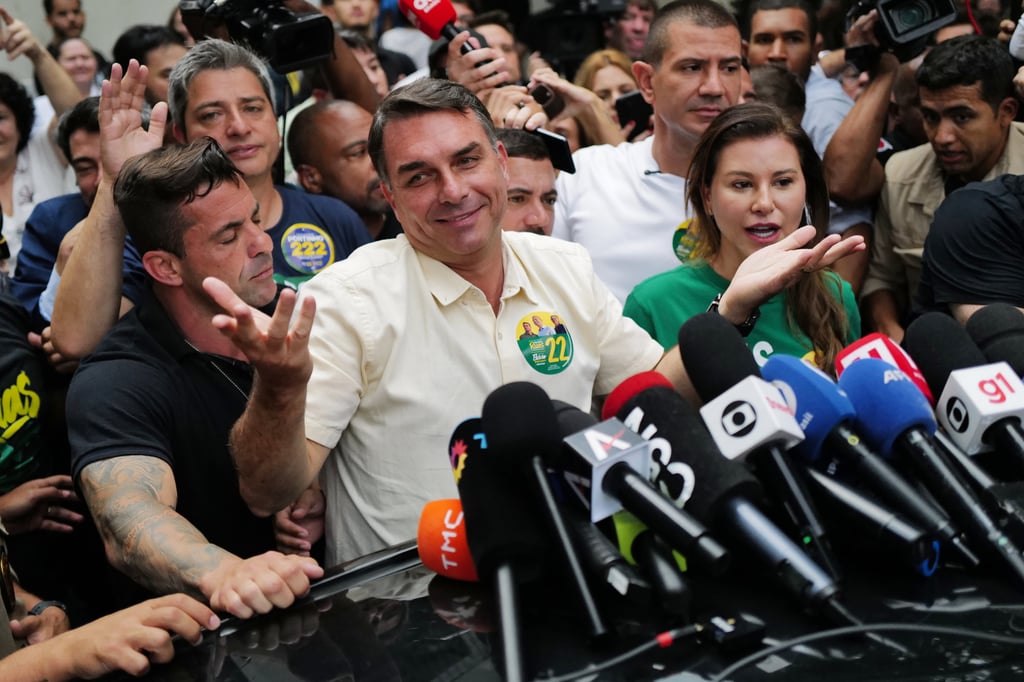 Opposition presidential candidate Senator Flavio Bolsonaro speaks after voting in Rio de Janeiro, Brazil on Sunday. Photo: AP Opposition presidential candidate Senator Flavio Bolsonaro speaks after voting in Rio de Janeiro, Brazil on Sunday. Photo: AP