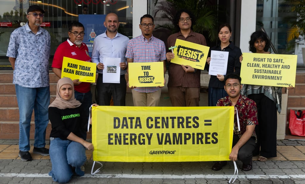 Protesters carry placards outside a city council office in Malaysia on July 27 as they rally against a data centre project at Kota Damansara. Photo: EPA