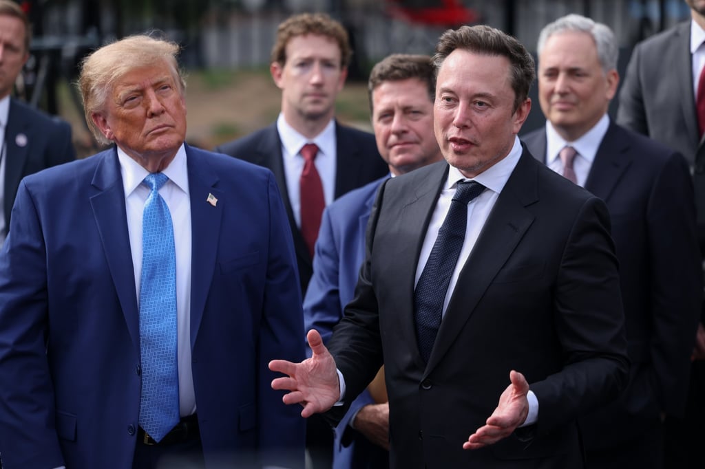 US President Donald Trump listens as Elon Musk speaks to reporters after an AI meeting with tech executives at the White House on September 29. Photo: EPA US President Donald Trump listens as Elon Musk speaks to reporters after an AI meeting with tech executives at the White House on September 29. Photo: EPA