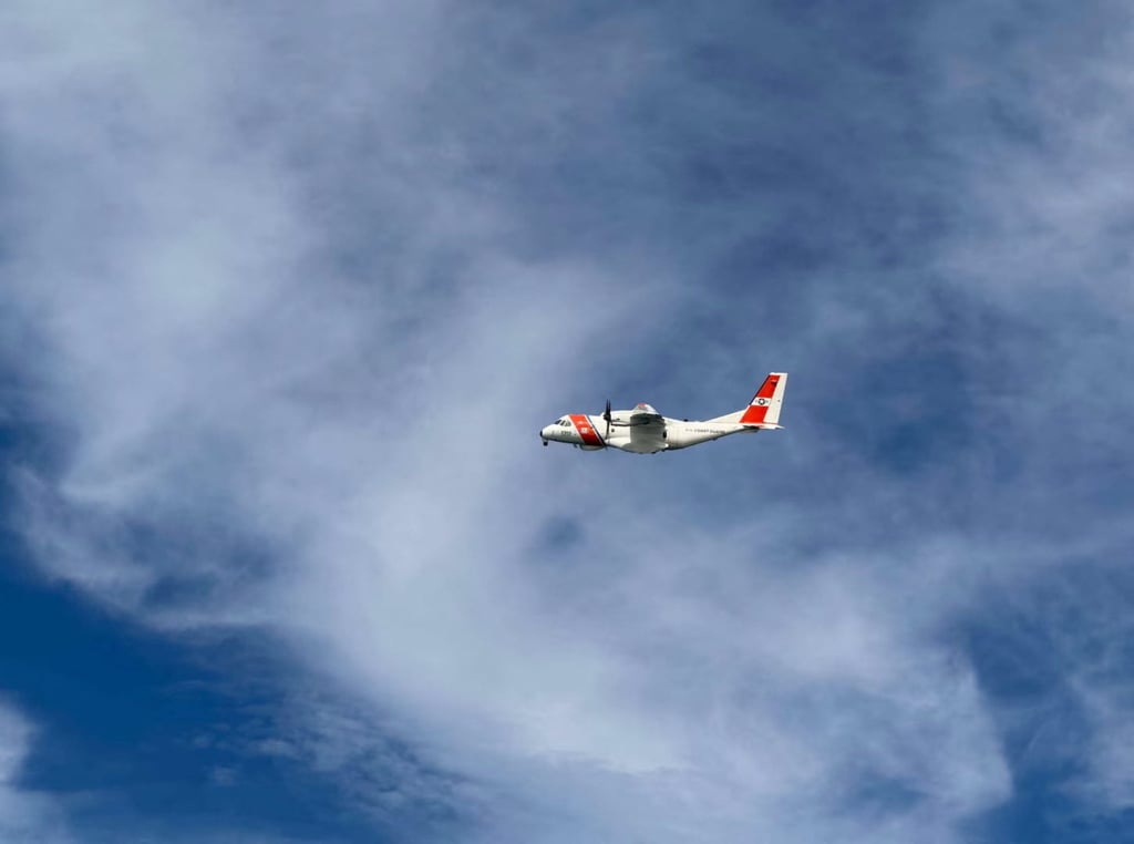 A US Coast Guard plane searches for people after it found debris from an air ambulance off the shore of Massachusetts’ Nantucket island on Saturday. Photo: US Coast Guard / Handout via Reuters