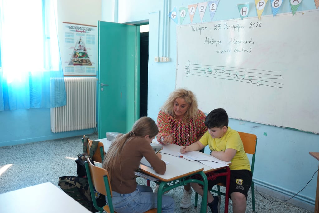 Chryssa Ntalaka teaches music to the two students of Kalamos Primary School on the island of Kalamos in the Ionian Sea, western Greece, in September. Photo: AP