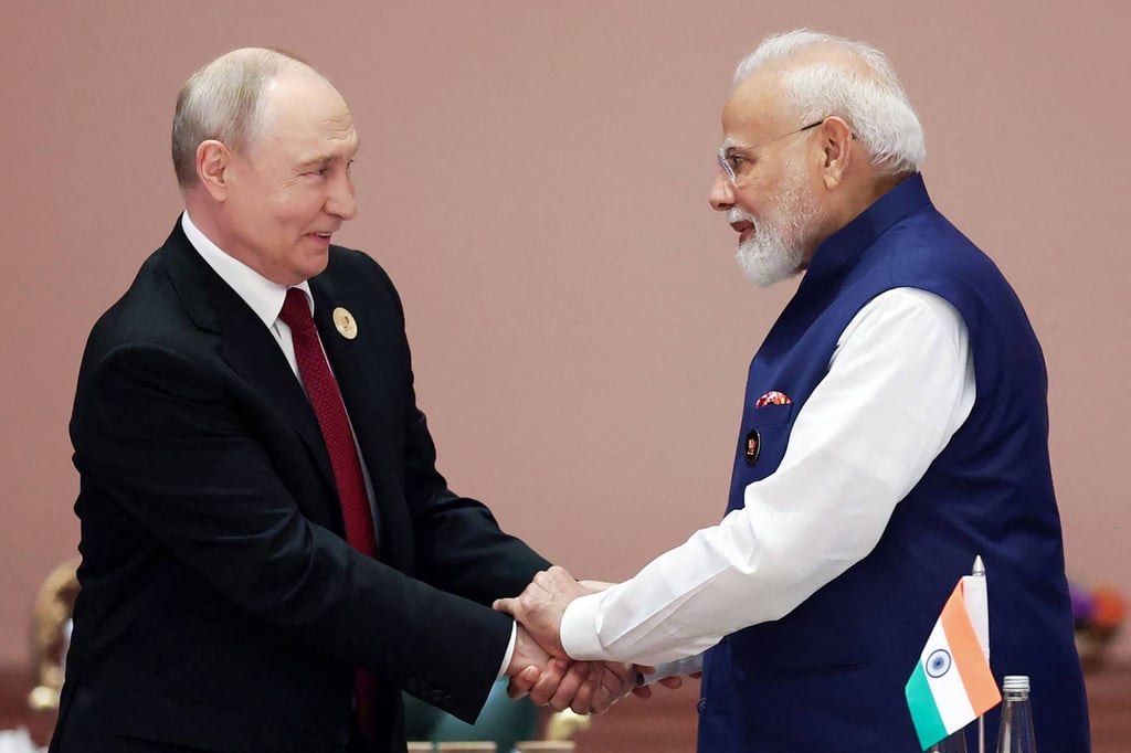 India’s Prime Minister Narendra Modi (right) shakes hands with Russia’s President Vladimir Putin during the Brics summit in Delhi on September 13. Photo: Indian Press Information Bureau / AFP