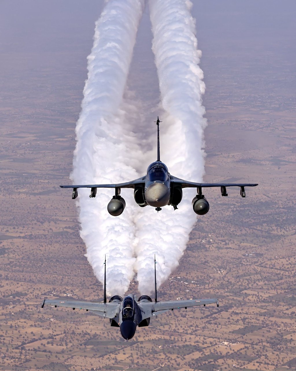 An Indian Air Force Sukhoi Su-30MKI (bottom) flies in formation with a HAL Tejas at Tarang Shakti 2026. Photo: X/IAF_MCC
