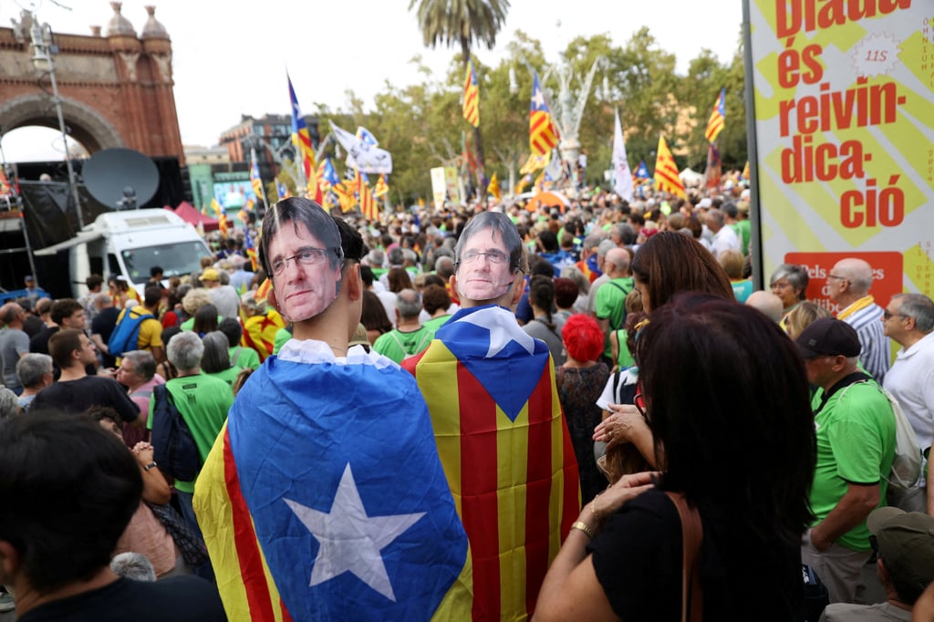People wear cardboard masks with the image of exiled Catalan separatist leader Carles Puigdemont during a demonstration on Catalonia’s national day of “La Diada” in Barcelona, Spain, on September 11, 2024. Photo: Reuters People wear cardboard masks with the image of exiled Catalan separatist leader Carles Puigdemont during a demonstration on Catalonia’s national day of “La Diada” in Barcelona, Spain, on September 11, 2024. Photo: Reuters