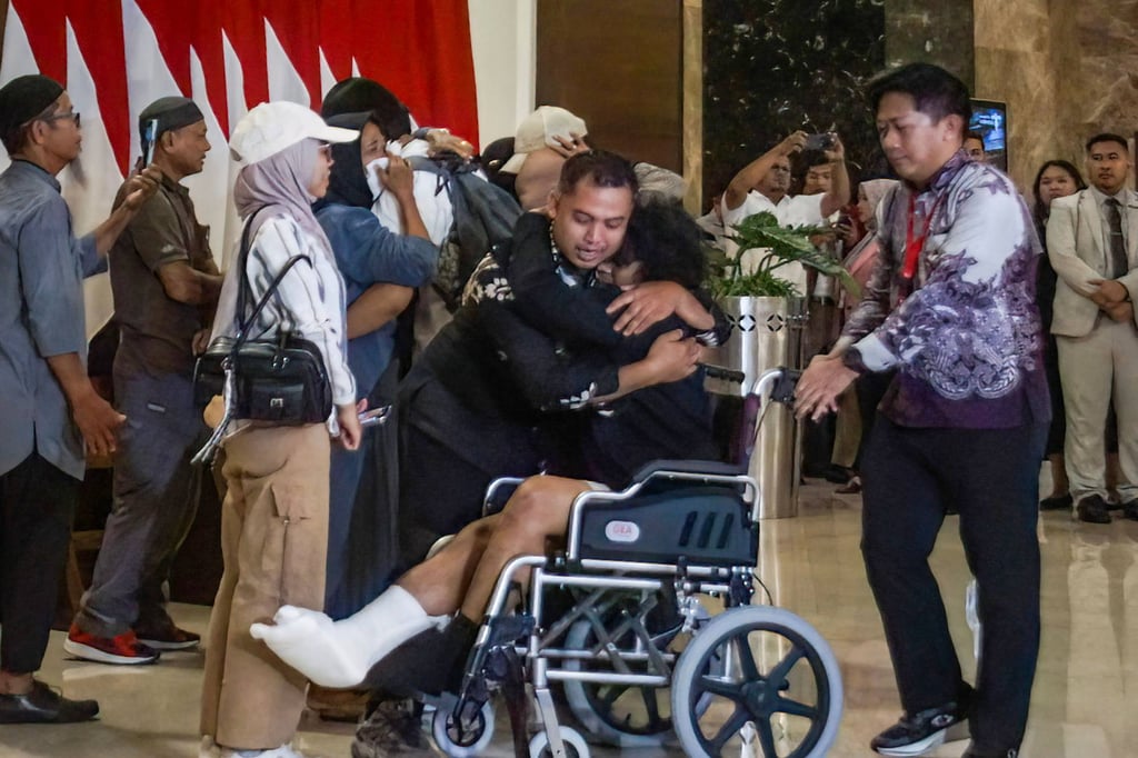 A returned Indonesian seaman (in wheelchair) is greeted by his loved ones upon his arrival at Soekarno-Hatta International Airport on Tuesday. Photo: AFP A returned Indonesian seaman (in wheelchair) is greeted by his loved ones upon his arrival at Soekarno-Hatta International Airport on Tuesday. Photo: AFP