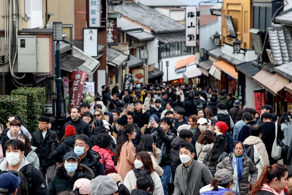 People walk up the hill leading to Kiyomizu-dera Temple in Kyoto, Japan. Photo: AFP People walk up the hill leading to Kiyomizu-dera Temple in Kyoto, Japan. Photo: AFP