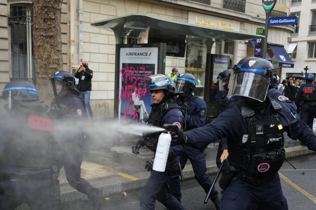 Police officers spray students near Sciences Po university as they protest against under-resourced schools, in Paris, France, on Wednesday. Photo: AP Police officers spray students near Sciences Po university as they protest against under-resourced schools, in Paris, France, on Wednesday. Photo: AP